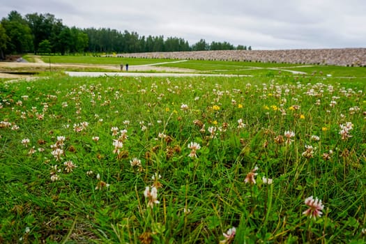 Scenery of stones and meadow in Koknese in the park Garden of Destinies in Latvia. Garden of Destinies is a monumental architectural ensemble on the Daugava Island in Koknese. Garden in Koknese.