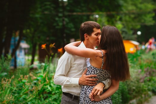 Beautiful young couple on a nature background.