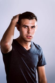 handsome young man in photo studio white background.