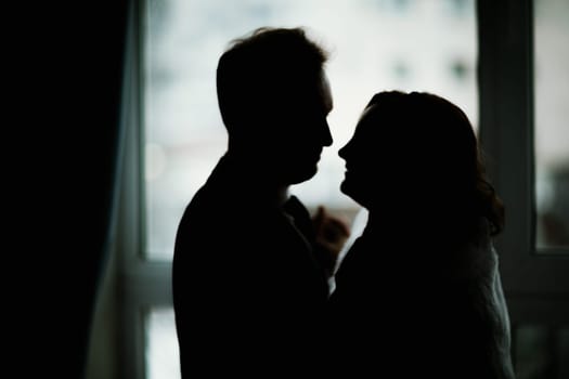 young bride and groom couple in a bright studio photo.