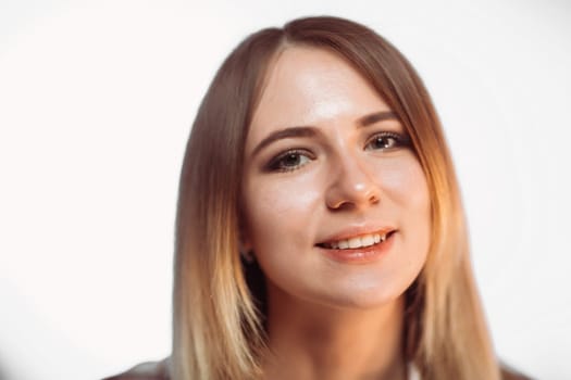portrait smiling girl on white background in studio.
