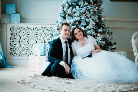 young bride and groom couple in a bright studio photo.
