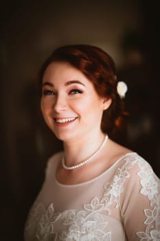 Portrait of a beautiful young bride near the window.