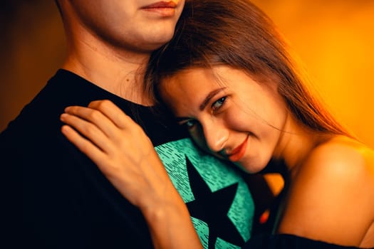 Girl and boy on the background of a sunset color.