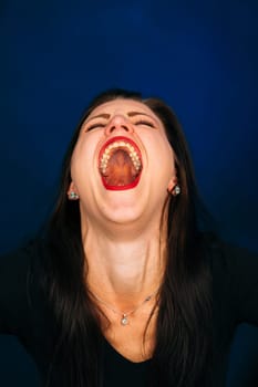 emotional cry girl on a dark background.