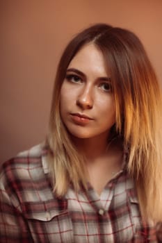 portrait smiling girl on orange background in studio.