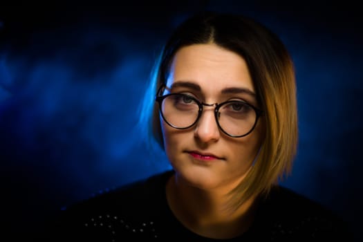 portrait emotional young girl on blue background.