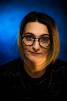 portrait emotional young girl on blue background.