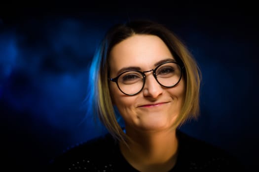 portrait emotional young girl on blue background.