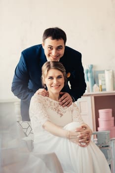 couple groom and bride near the window.