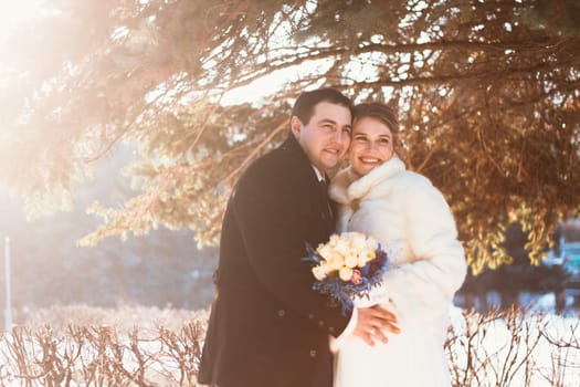 Winter bright wedding bride and groom couple.