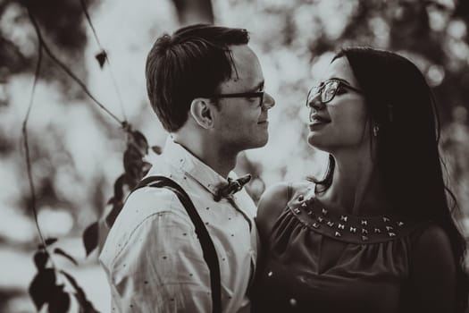 Beautiful young couple on the park background.