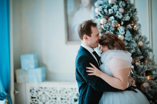 young bride and groom couple in a bright studio photo.
