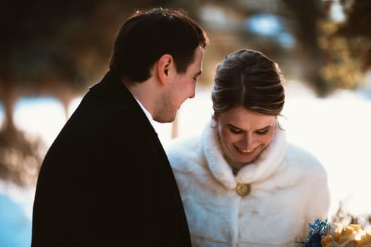Lovers bride and groom on their winter wedding.