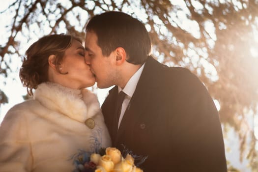 Lovers bride and groom on their winter wedding.