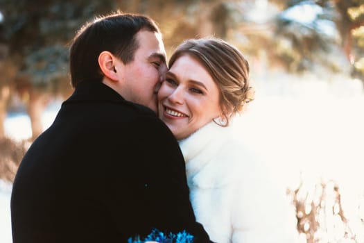 Lovers bride and groom on their winter wedding.
