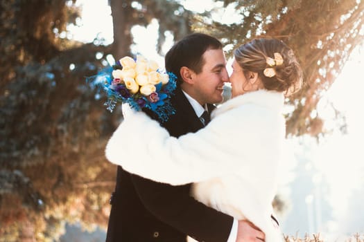 Winter bright wedding bride and groom couple.