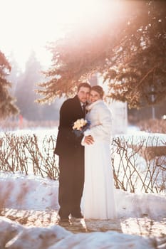 Winter bright wedding bride and groom couple.