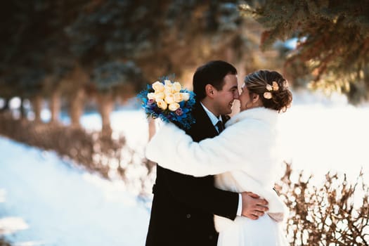 Winter bright wedding bride and groom couple.