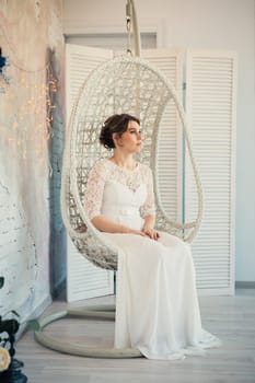 portrait of a bride in white studio.
