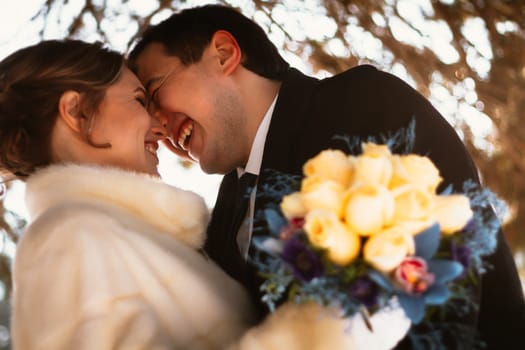Lovers bride and groom on their winter wedding.