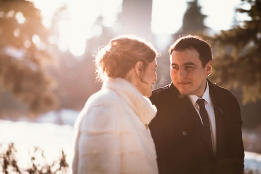 Lovers bride and groom on their winter wedding.