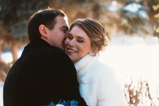 Lovers bride and groom on their winter wedding.