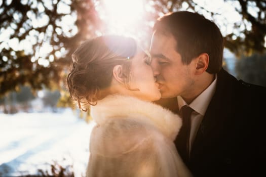 Lovers bride and groom on their winter wedding.