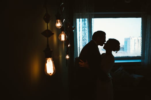 couple groom and bride in light studio.