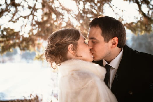 Lovers bride and groom on their winter wedding.