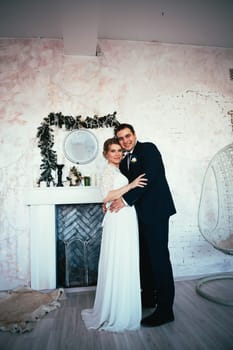 couple groom and bride in the studio.