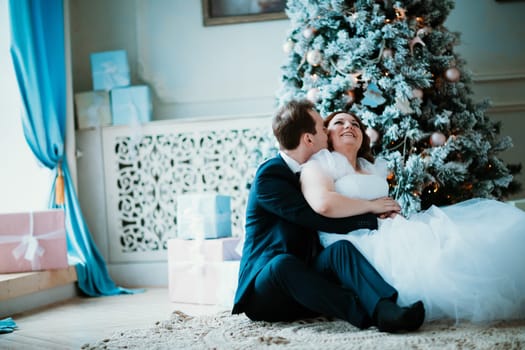 young bride and groom couple in a bright studio photo.