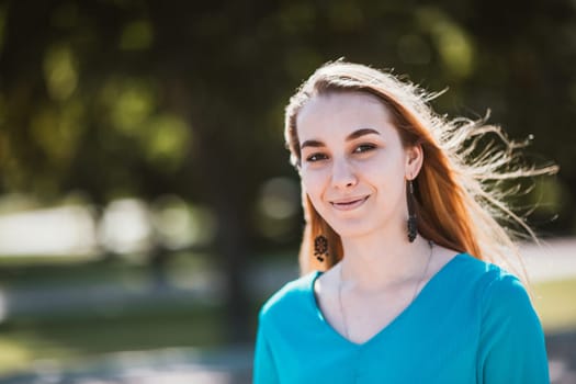 Portrait of a young woman on a blurred background.