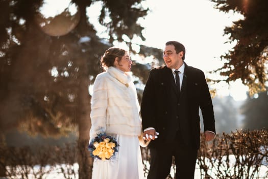 Lovers bride and groom on their winter wedding.