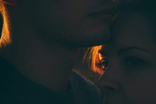 guy and girl in the field on the sunset background.