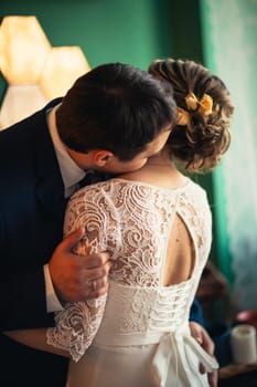 couple groom and bride in light studio.