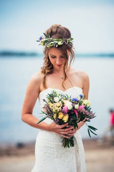 portrait of the bride against the background of the river.