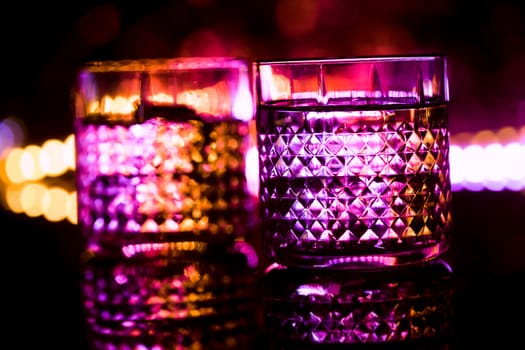 bar colored lights with glasses of alcohol.