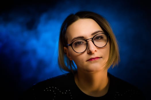 portrait emotional young girl on blue background.