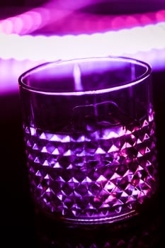 bar colored lights with glasses of alcohol.