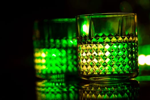 bar colored lights with glasses of alcohol.