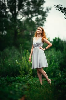 portrait of a girl against a nature background.