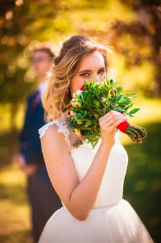 bride and groom on background summer forest.