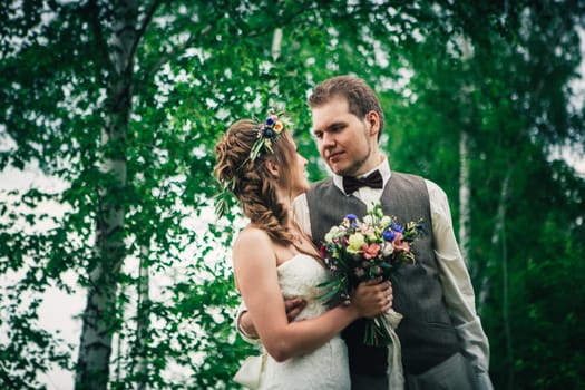 Young bride and groom in the style of provence.