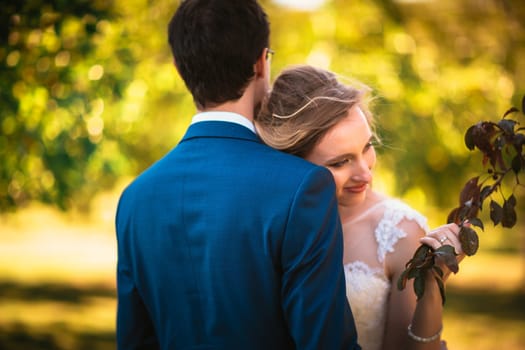 bride and groom on background summer forest.