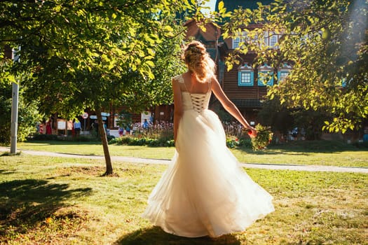 beautiful young bride in the garden background.