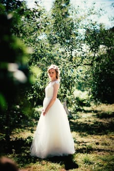 beautiful young bride in the garden background.