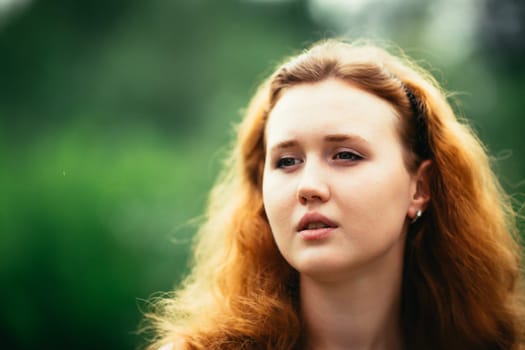 portrait of a girl against a nature background.