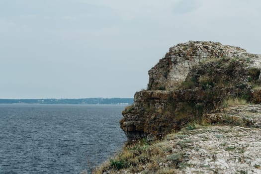 landscape river cliff grass on the sky background.