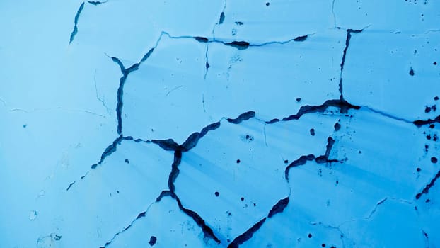 The Rusty painted metal texture, old iron surface with shabby cracked paint and scratches